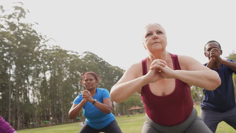 Group of senior people doing exercise in a park