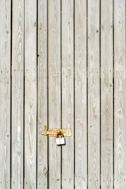istock Wall of vintage white boards covered. 1459802351