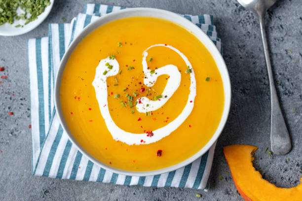 istock Autumnal soup in bowl on grey background 1459807643