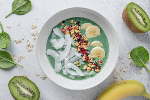 istock Green smoothie in bowl with fruits 1459807682
