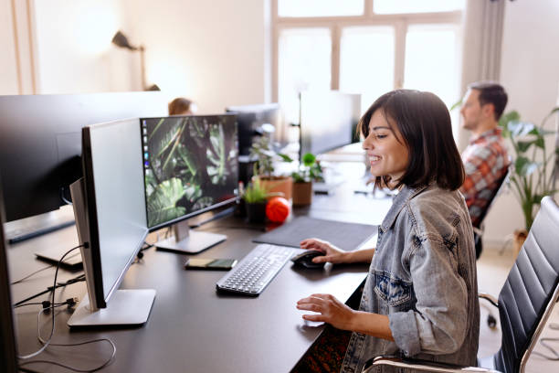 istock Woman working in an open office with his creative design team 1459816223