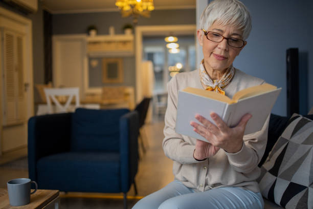 istock Woman relaxing and reading a book 1459817256