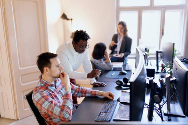 istock Colleagues having an impromptu meeting 1459824878