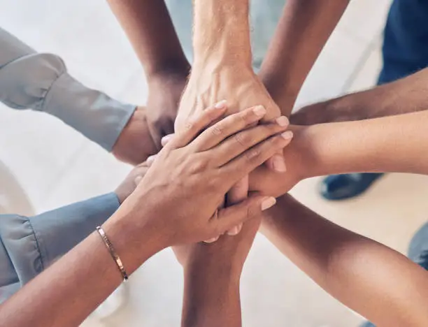 Photo of Teamwork, hands together and team building of business people with support, collaboration or startup mission for company background. Hand stack sign, community and solidarity group in diversity above