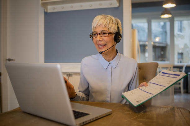 istock Senior woman working from home 1459827501