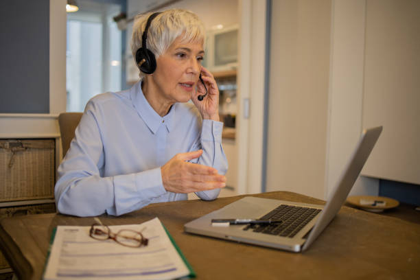 istock Senior woman working from home 1459827524