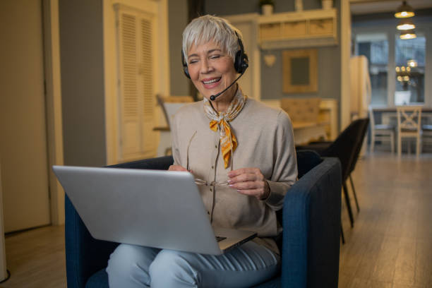 istock Senior woman working from home 1459827666