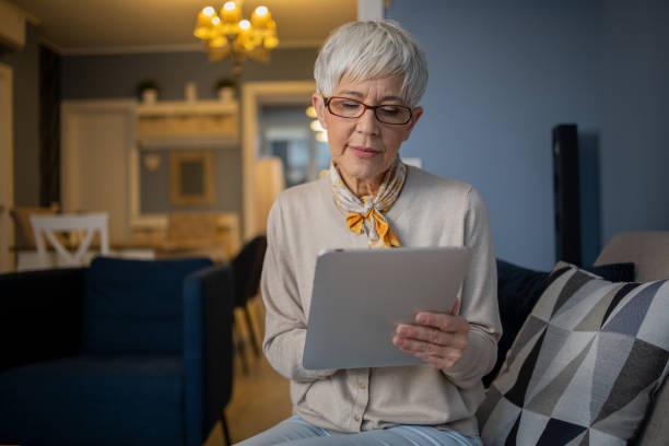 istock Portrait of a senior woman using digital tablet 1459828107