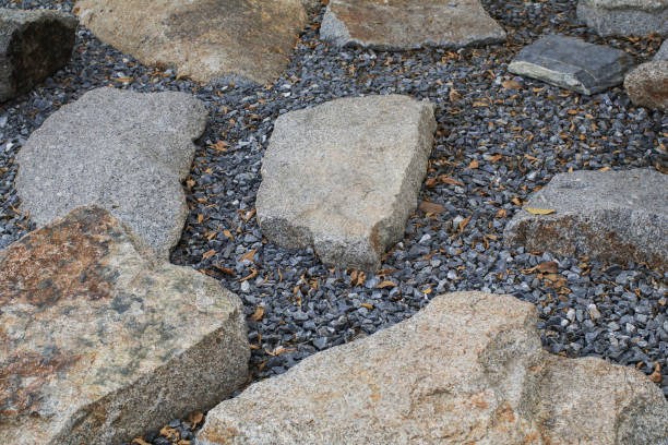 istock Stones on gravel bed garden architecture, pathway accessory. Rock texture for background. Backyard Garden Modern Design Landscaping. 1459828112