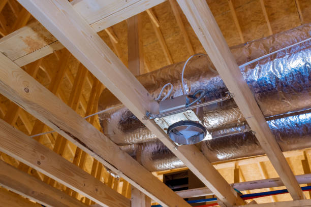 istock The ceiling inside a new stick-built home in the process of being built has ventilation pipes covered in silver insulation material 1459828328