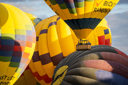 Albuquerque, New Mexico - USA - Oct 9, 2022: Several hot air balloons preparing to launch at the Albuquerque International Balloon Fiesta