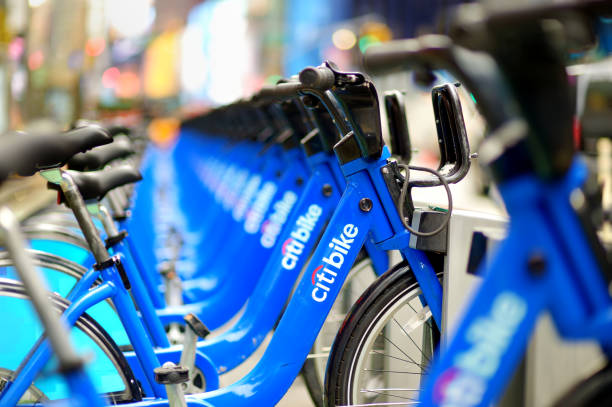 Row of Citi bike rental bicycles at docking station in New York City. Shared bikes lined up in the street of NYC, USA. New York - March 15, 2015: Row of Citi bike rental bicycles at docking station in New York City. Shared bikes lined up in the street of New York, USA. bicycle docking station stock pictures, royalty-free photos & images