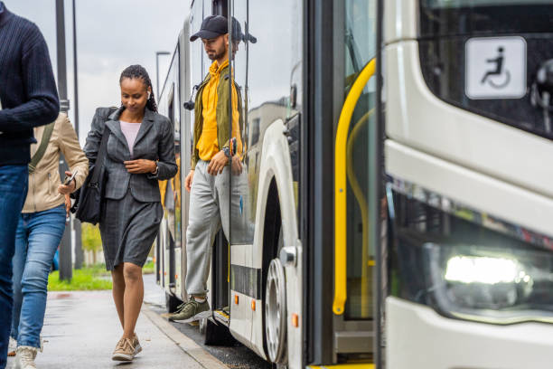 istock Multiethnic people leaving commuter bus 1459839632
