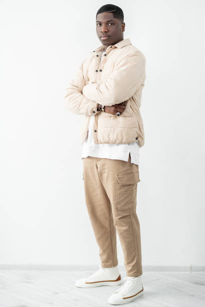 istock Confident man portrait Trendy beige outfit studio 1459839701