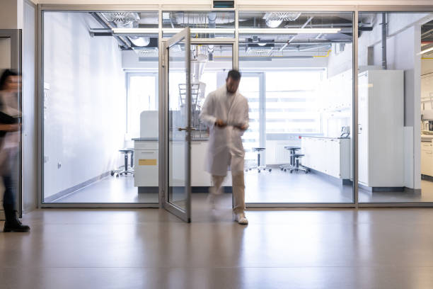 The laboratory assistant exits the laboratory.
