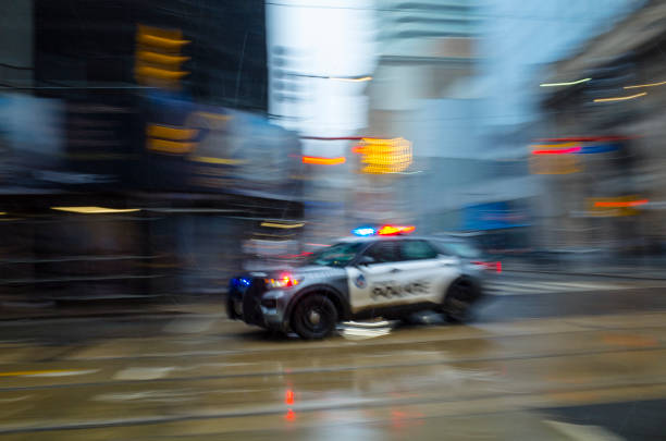 toronto police car in motion blur - car bodywork flash imagens e fotografias de stock