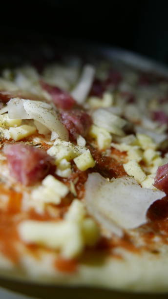 istock Making dinner: Pepperoni pizza with mozzarella. Cooking time 1459848636