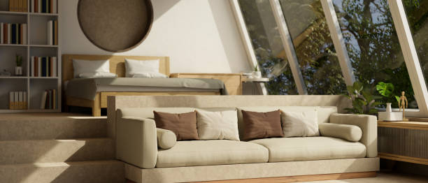 istock Contemporary cozy spacious bedroom interior design with bed, comfy couch, bookshelf, decor 1459855560