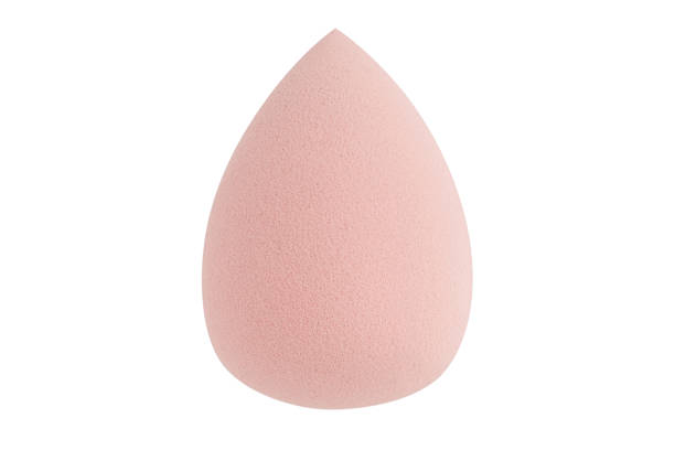 istock Light nude pink makeup sponge on a white background. beauty blender 1459855714