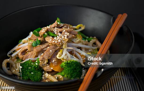 A Bowl Of Asian Stir Fry With Chopsticks Stock Photo - Download Image Now - Asia, Backgrounds, Bamboo - Material