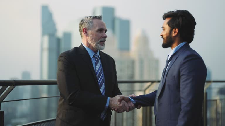 Multi ethnic business partner coworker meeting on rooftop