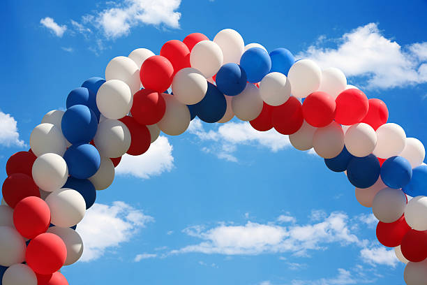 A red white and blue balloon arch