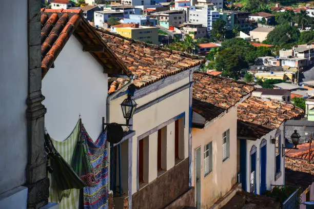 The colonial architecture on a steep street in the historic district near the Santuário do Bom Jesus de Matosinhos, Congonhas, Minas Gerais state, Brazil