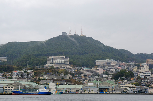 Mt. Inasa smoked in the rain seen from Nagasaki Port