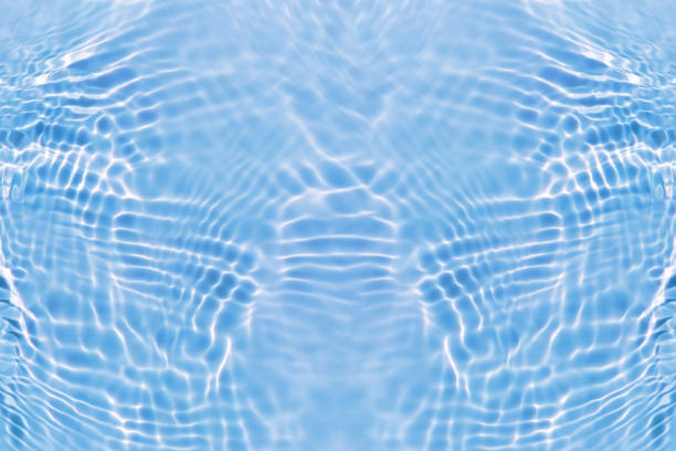 istock Defocus blurred transparent blue colored clear calm water surface texture with splashes and bubbles. Trendy abstract nature background. Water waves in sunlight with copy space. Blue watercolor shining 1459877020