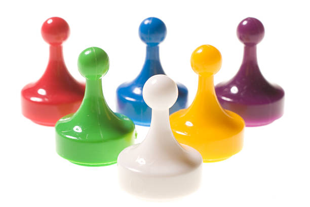 istock Lineup of game pieces isolated on white 145987859