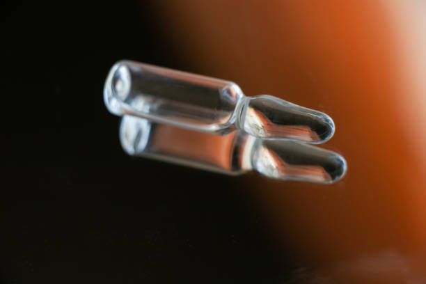 istock ampoule with medicine lies on a mirror close-up 1459878982