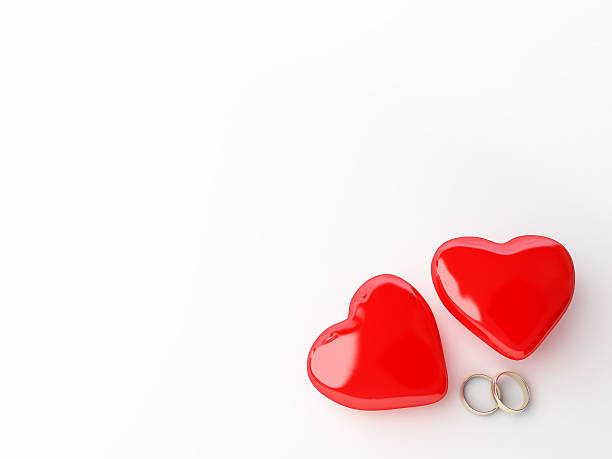 Wedding rings and heart stock photo