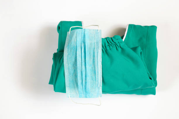 medical uniform set folded on isolated background nurse