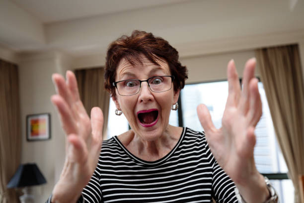 istock Senior woman indoors with an excited expression 1459881968