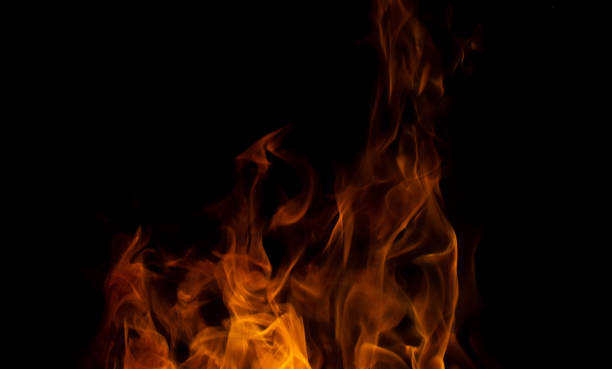 istock Sparks from a flame in motion on a black background. Abstraction of blurred flame. 1459884974