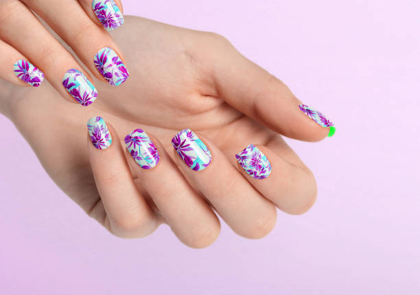 istock Beautiful female hands with pink leaf manicure. Female hands on copy space. 1459885199