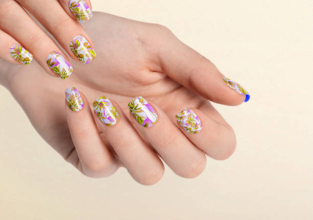 istock Beautiful female hands with orange yellow leaf manicure 1459885214