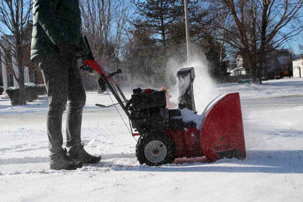 istock A man  is cleaning  snow from sidewalks with a snow blower after a snowstorm. 1459885431