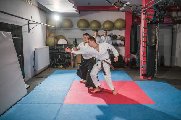 istock During aikido training, an aikido master teaches fighters throwing technique and self-defense 1459885606