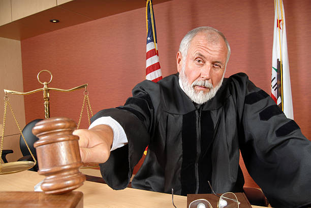 Judge using his gavel stock photo