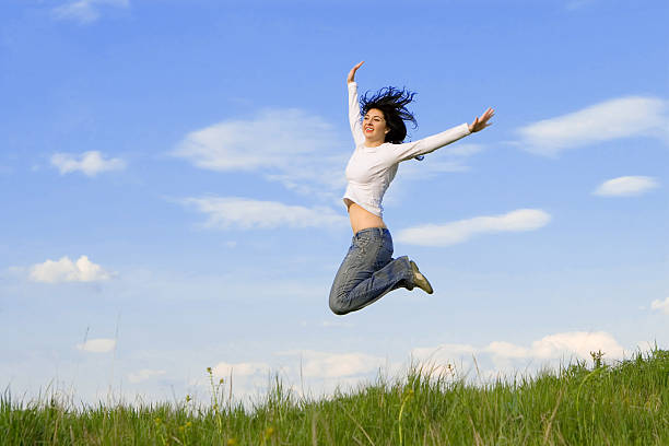 istock happy young woman is jumping 145989128