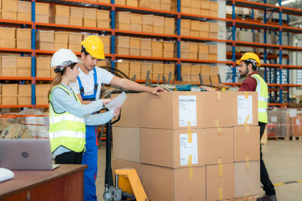 istock Group of warehouse workers having a meeting 1459895075