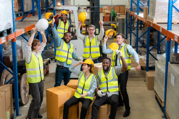 istock Raised angle portrait group photo of workers inside a food distribution warehouse 1459895160