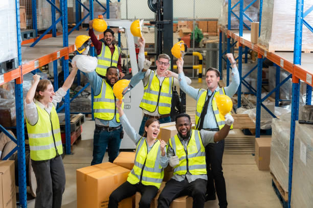 istock Raised angle portrait group photo of workers inside a food distribution warehouse 1459895174