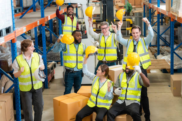 istock Raised angle portrait group photo of workers inside a food distribution warehouse 1459895189
