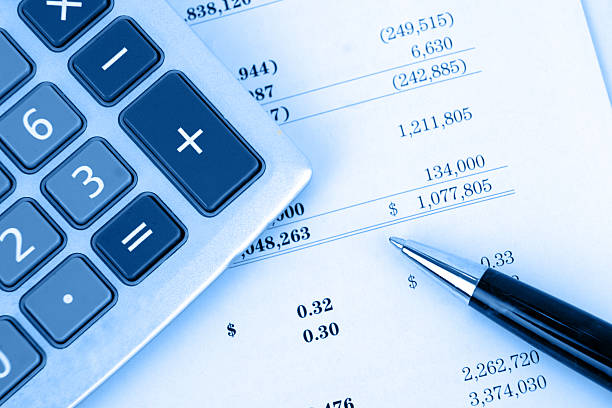 istock Calculator on balance sheet with blue overlay 145989767