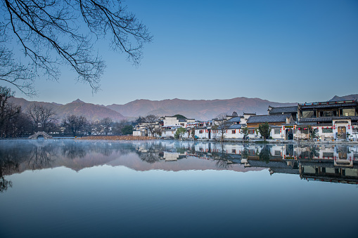 Wooden houses, green rivers, lush vegetation. Beautiful scenery. Zhoushui Ancient Town is a historical and cultural attraction. Chongqing, China.