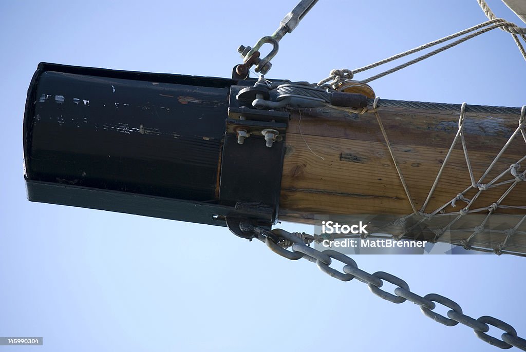 Tip of a tall ships bowspirit Close up of a tall ships bowspirit against the blue sky Blue Stock Photo
