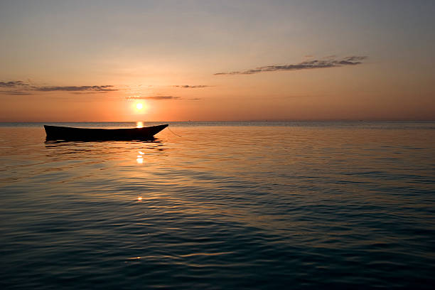 istock row boat at sunset in zanzibar africa 1 145990319