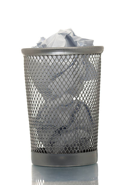 istock Mesh trash bin full of paper 145990790